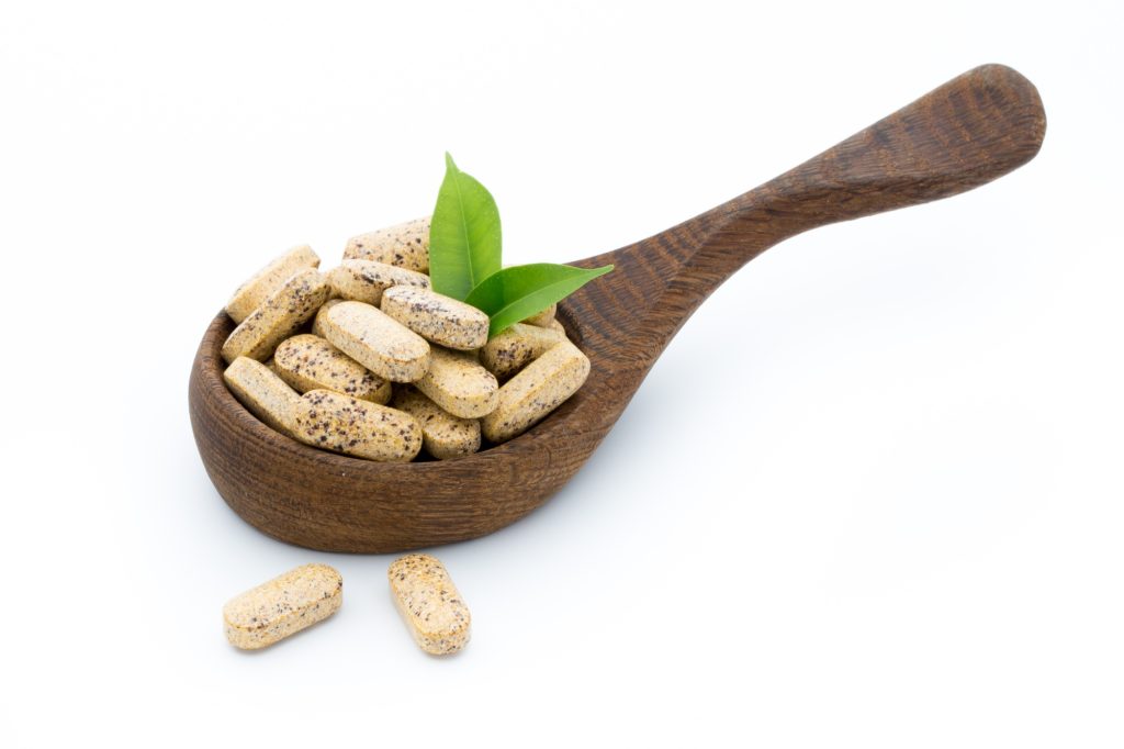 Alternative Medicine. Vitamin capsules. Homeopathic supplement.