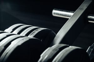 Gym weight plates on holder close up